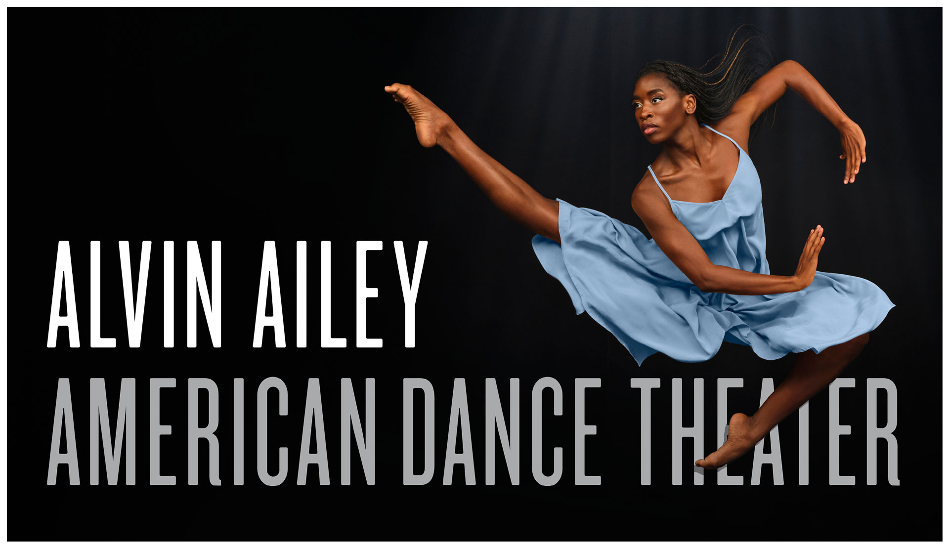 IMAGE: Promotional photograph shows Alvin Ailey American Dance Theater company member Caroline T. Dartey posed atop the AAADT logo.
