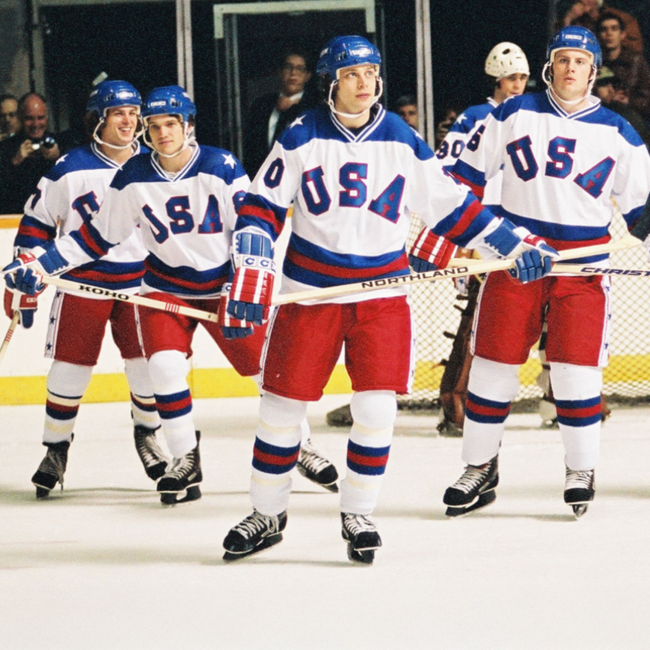 Film still of a scene from "Miracle": Members of the 1980 U.S. Men's Olympic Hockey Team skating.
