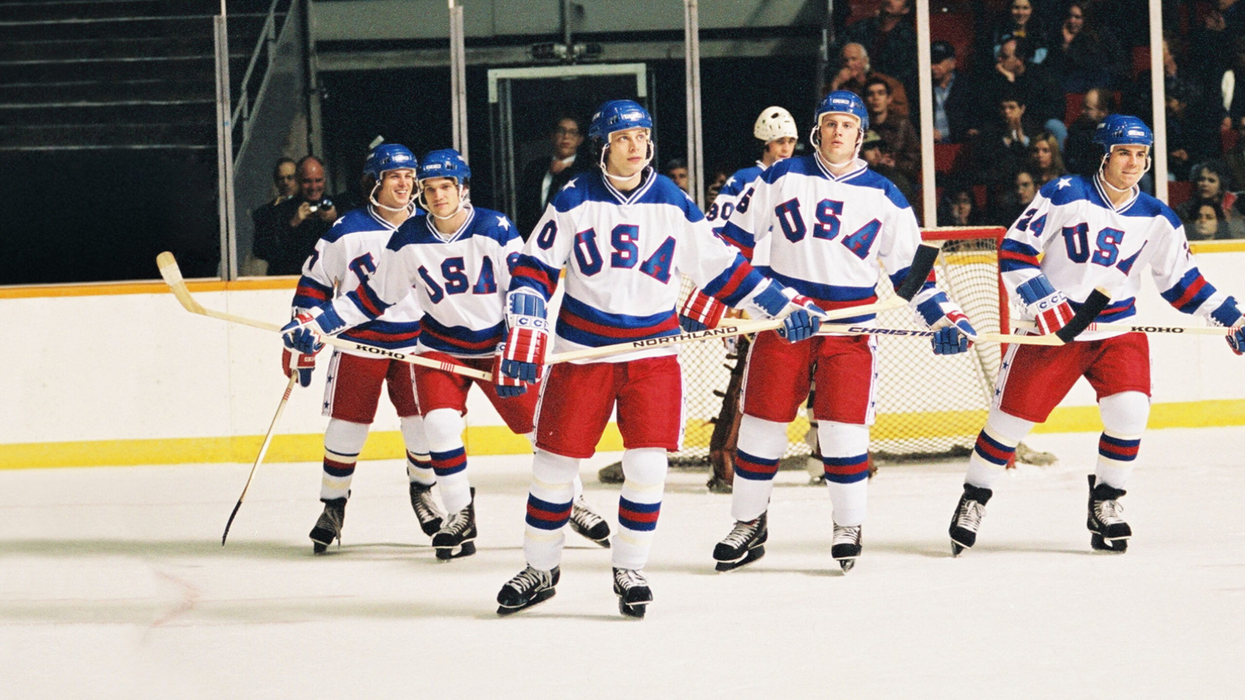 Film still of a scene from "Miracle": Members of the 1980 U.S. Men's Olympic Hockey Team skating.