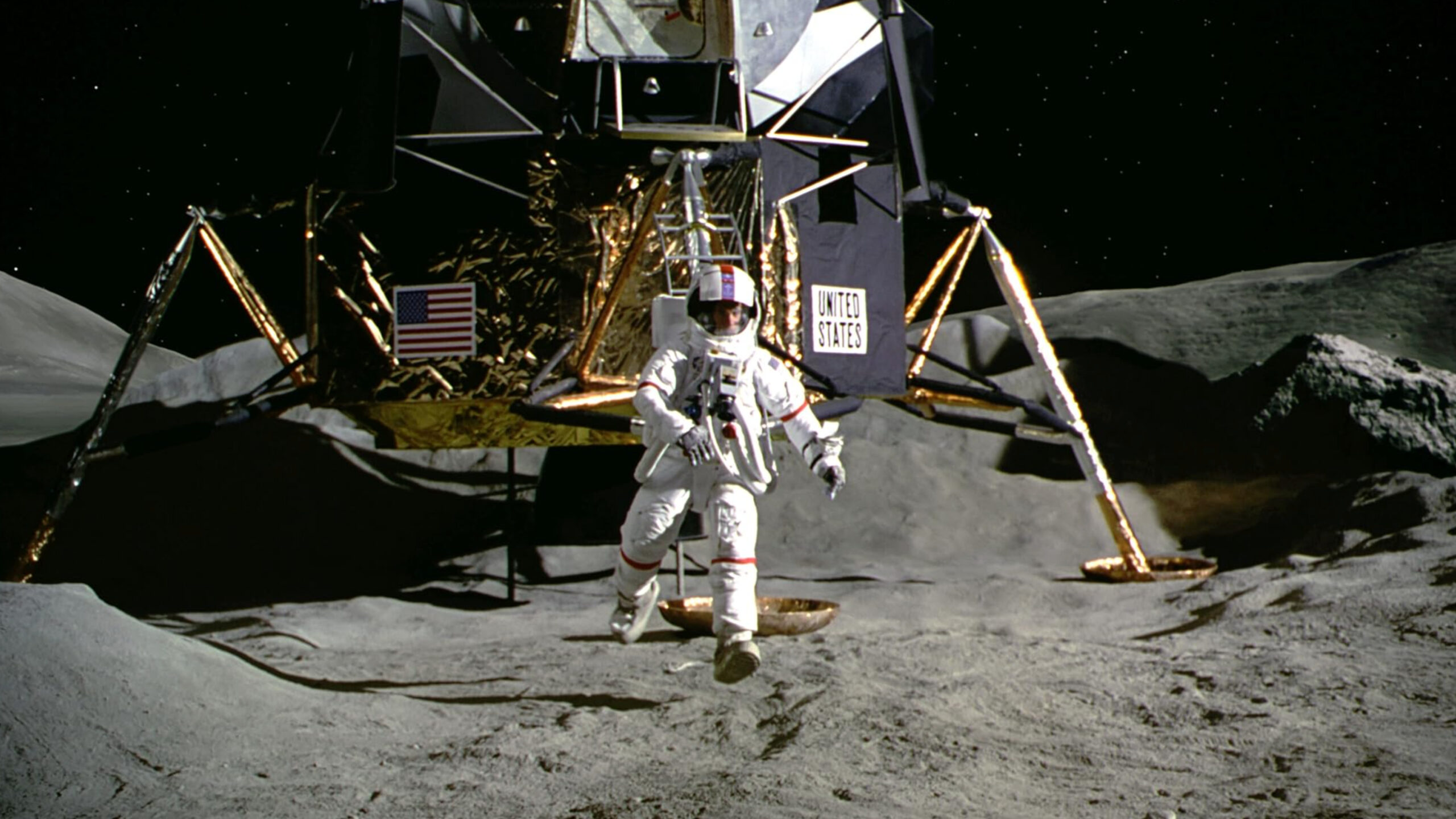 Film still of a scene from "Apollo 13": An astronaut walking on the surface of the moon.