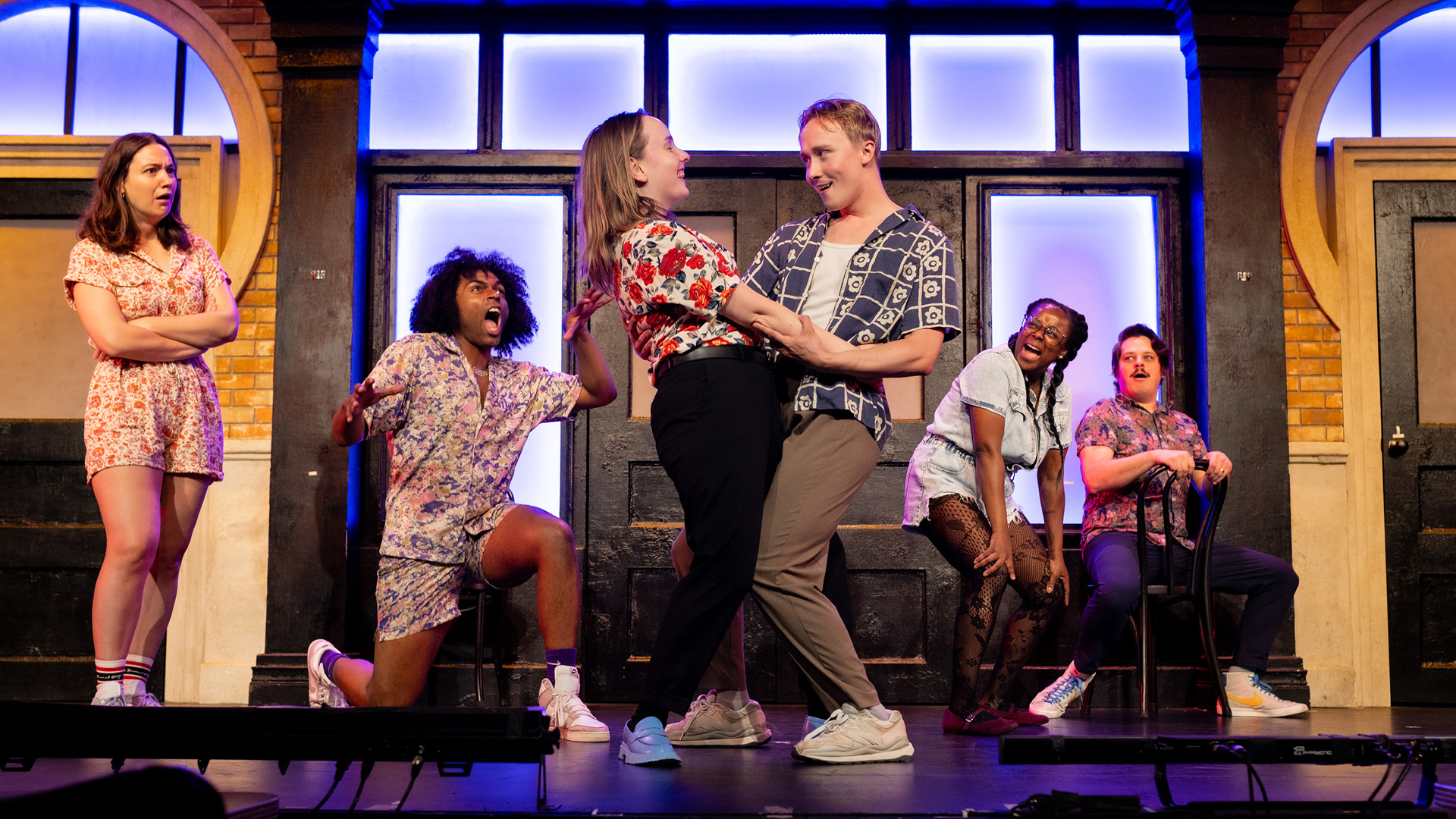 Second City members dancing in sketch.