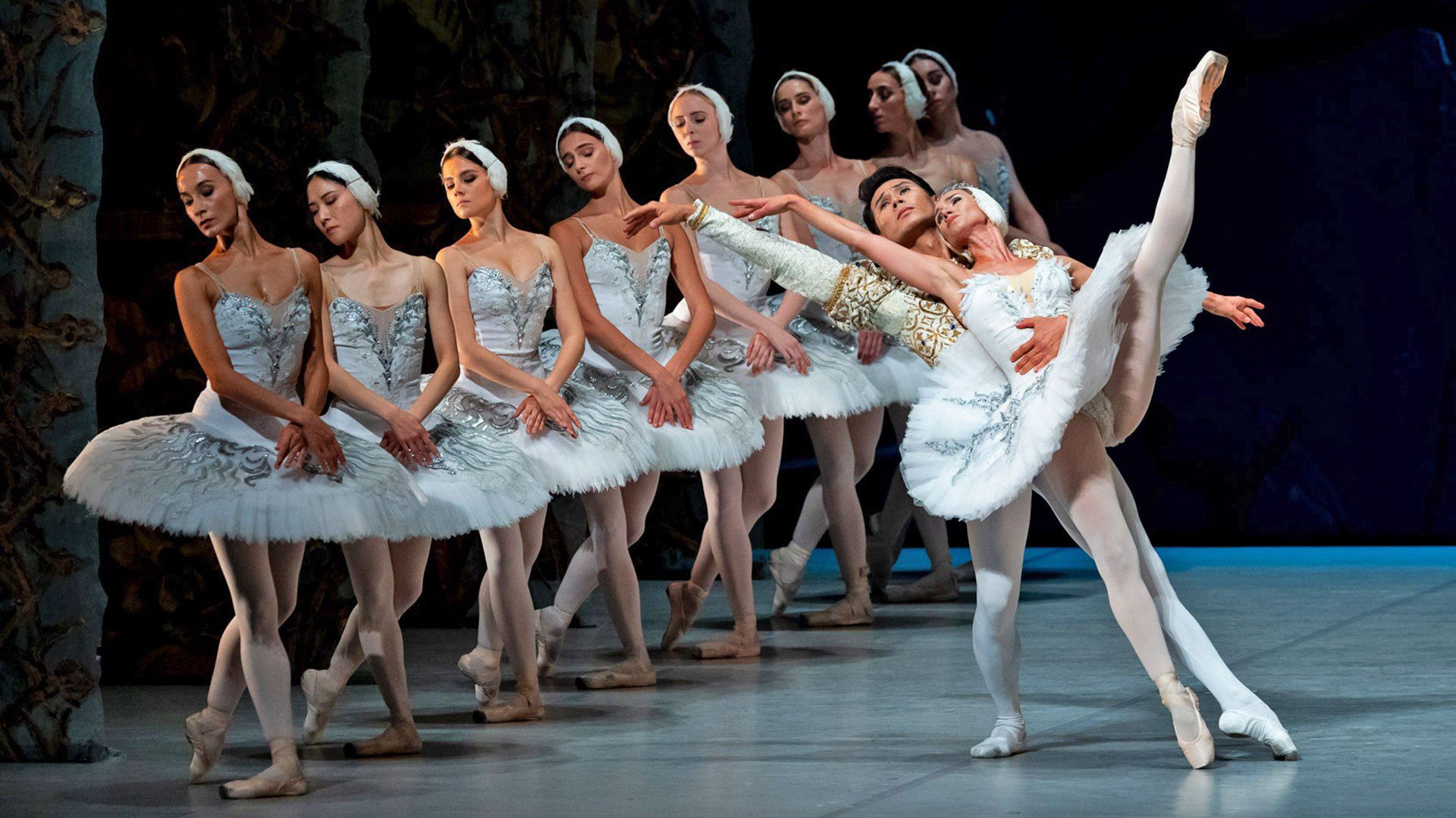 Ballet dancers performing together in Swan Lake.